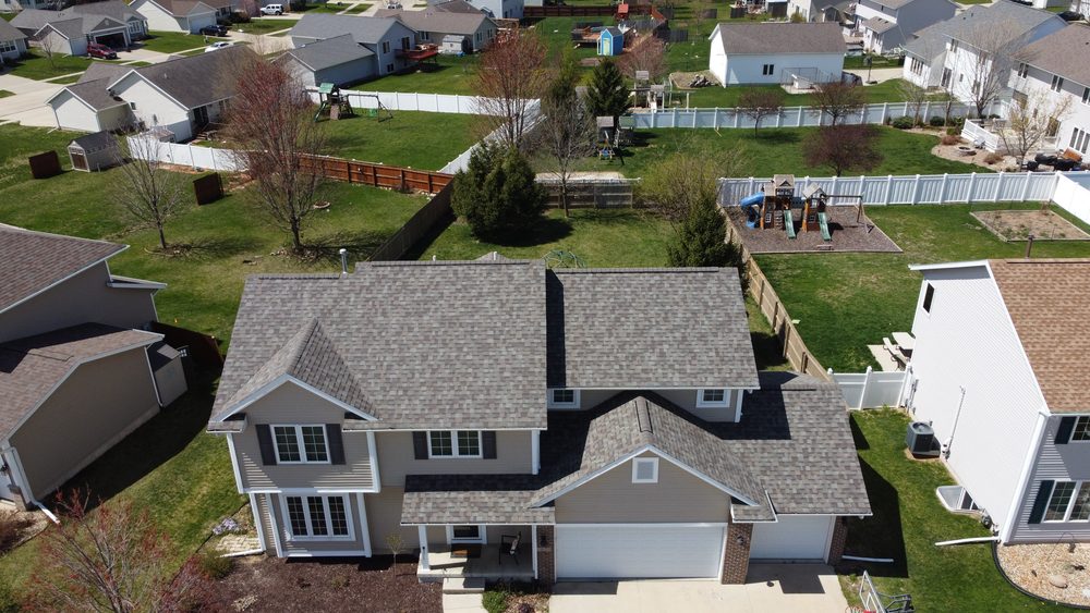 Aerial neighborhood view of a Trego Roofing project, Eastern Iowa