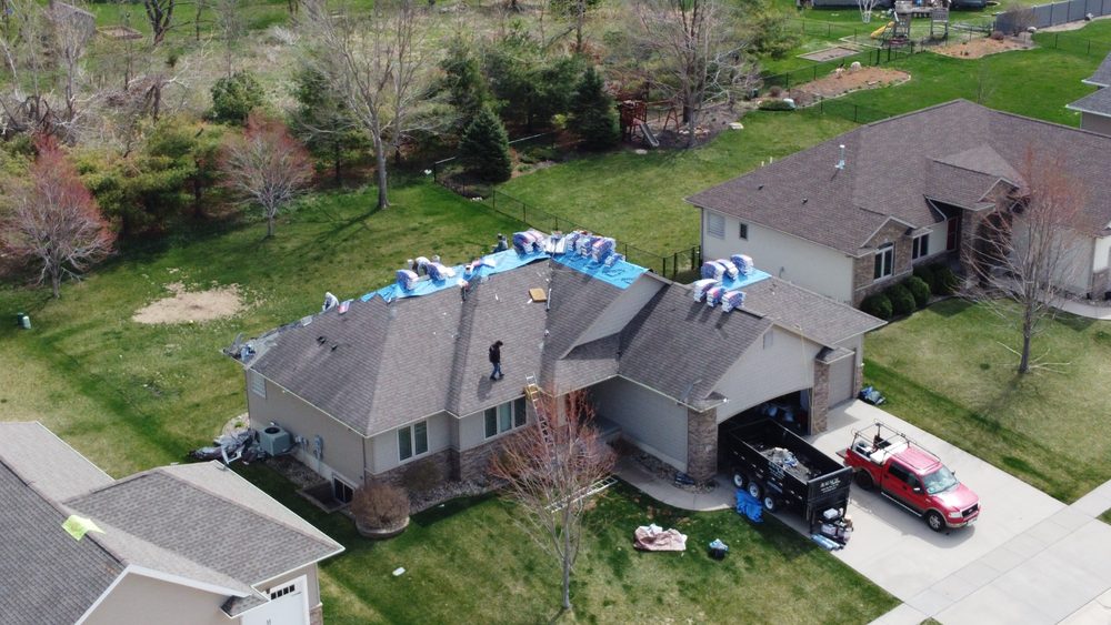 Trego Roofing crew on site during a roof replacement, Eastern Iowa