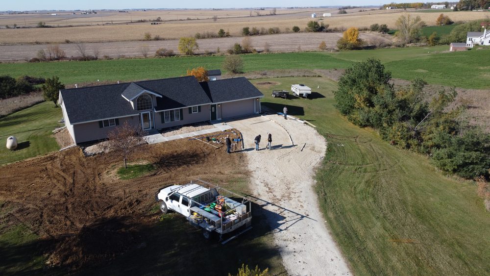 Trego Roofing crew finishing a roof replacement, Eastern Iowa