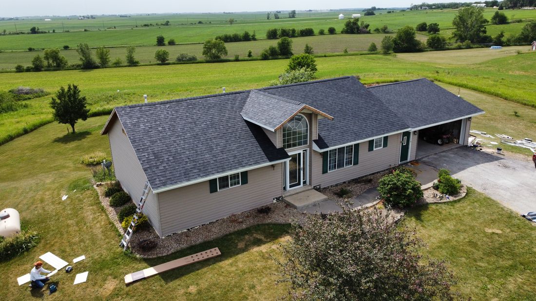 Aerial view of a completed roof on a rural property