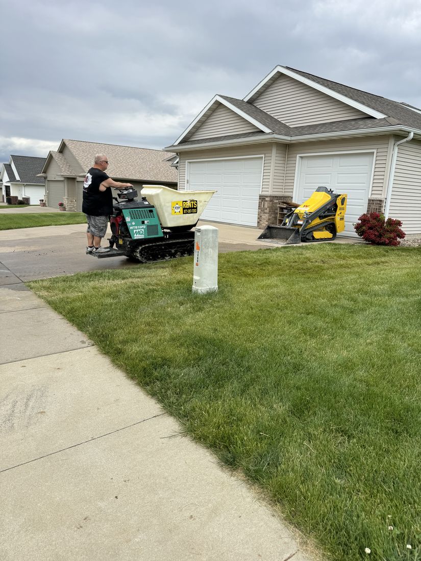 Trego Roofing crew and equipment staged in a driveway