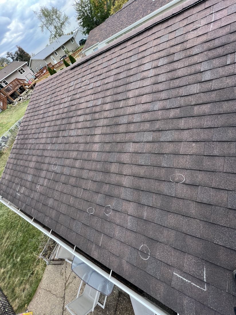 Close-up detail of asphalt shingle repair work by Trego Roofing