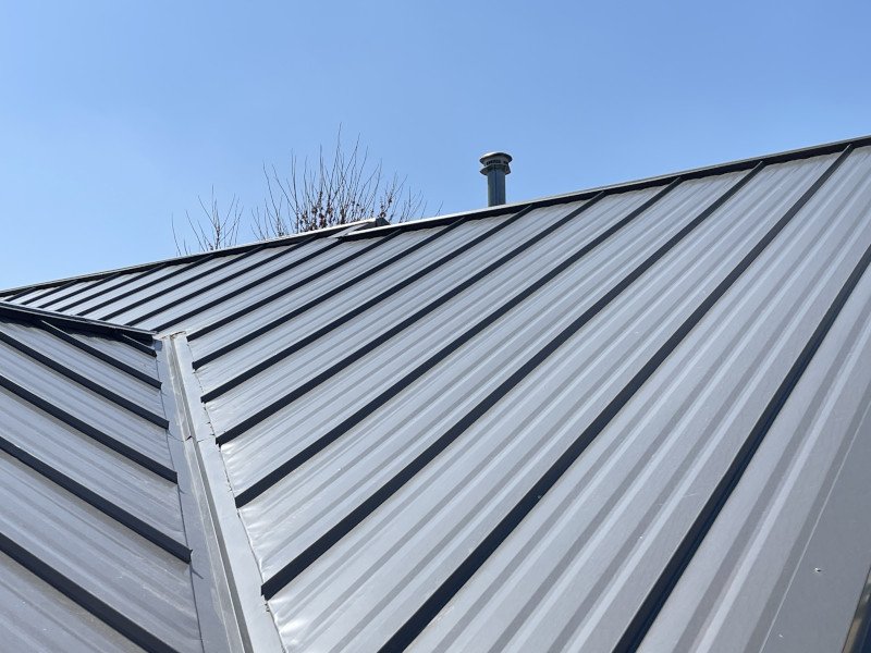 Close-up of standing seam metal roof panels installed by Trego Roofing
