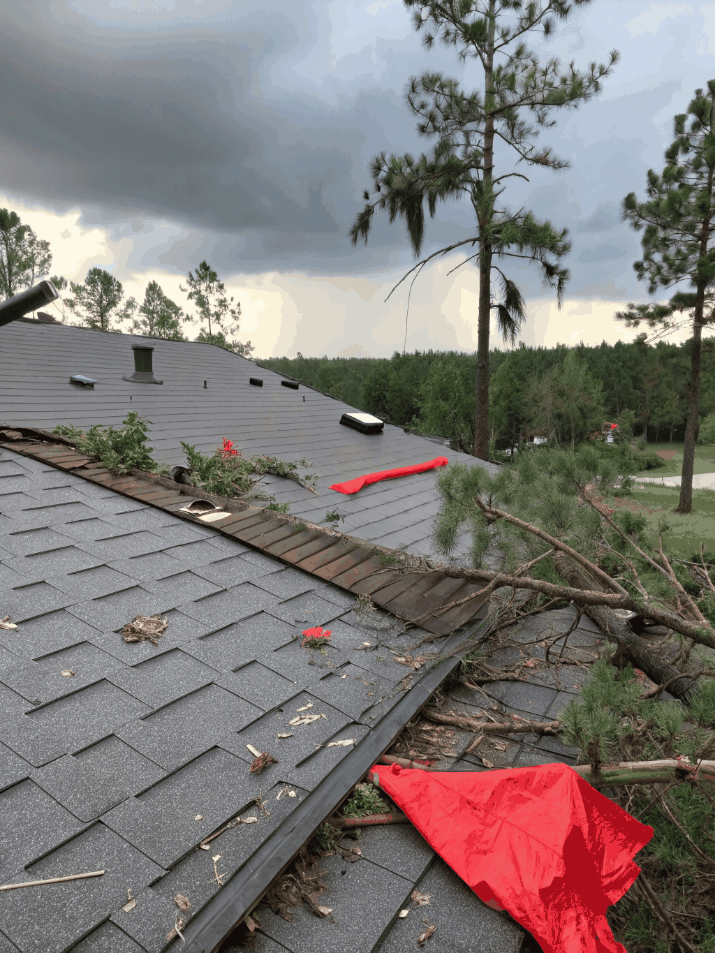 Close-up of hail impact assessment on residential roof shingles